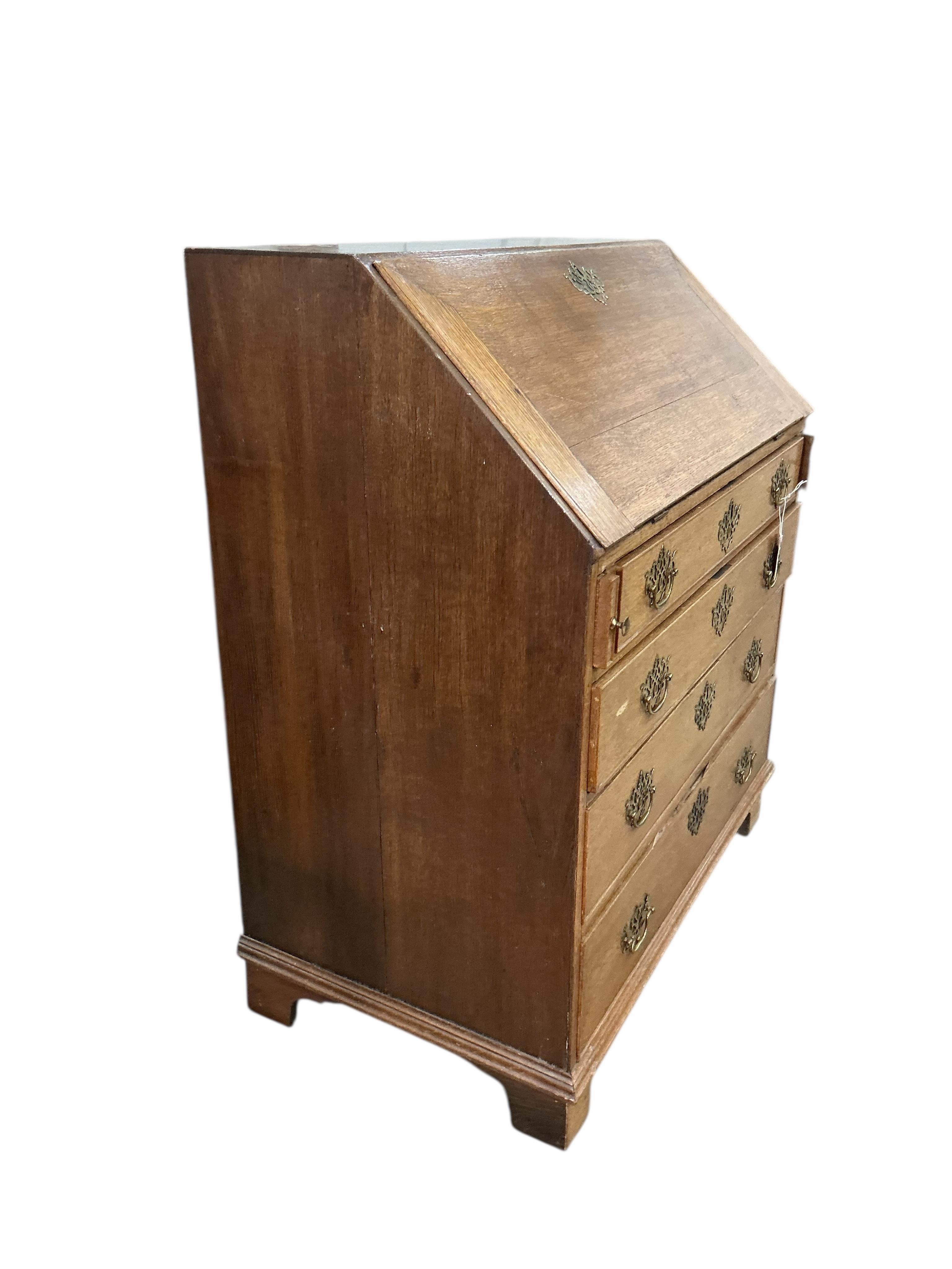 A George III oak bureau, width 91cm, depth 52cm, height 105cm